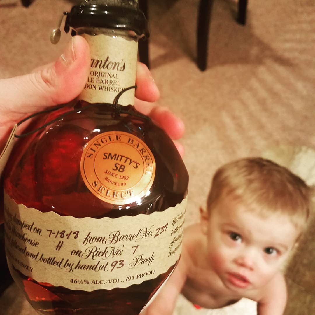 Bottle of Blantons with a dump day of sons birthday. My so is 2 years old standing in the background