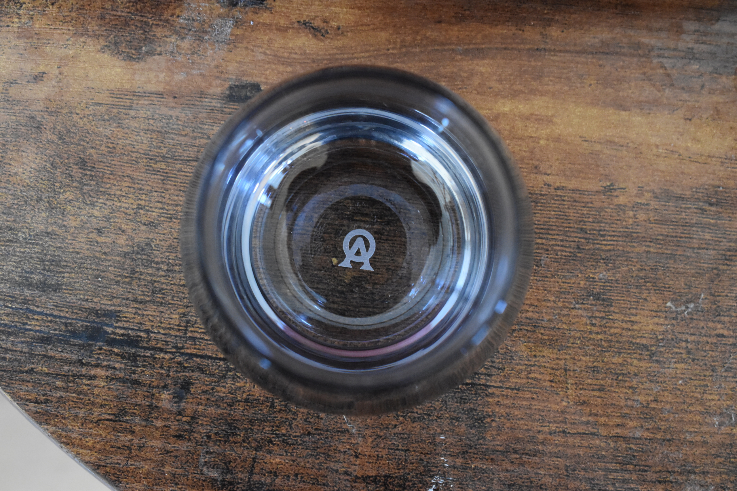 Top down view of an Aged & Ore Polished gray neat glass