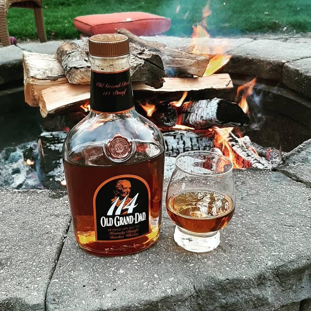 Old Grand dad 114 bottle I'm front of a outdoor fire